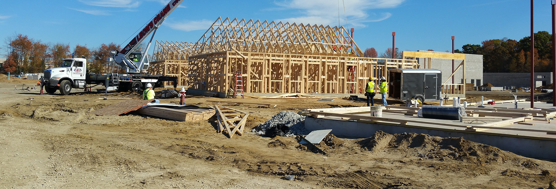 Wood framing going up on a ground-up BWM Construction building site